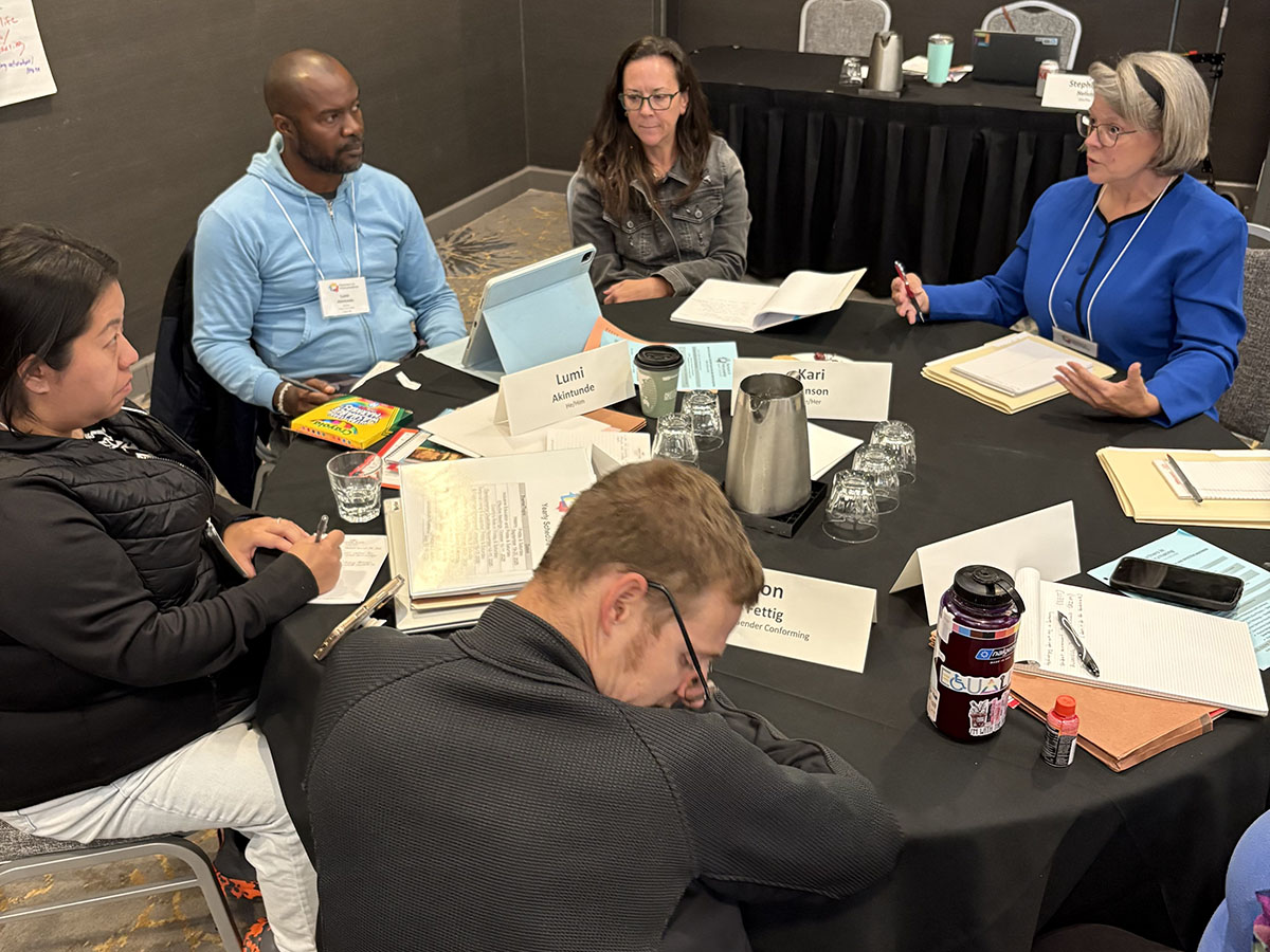 Class 43 October Session participant using wheelchair smiling