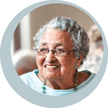 woman with glasses smiling